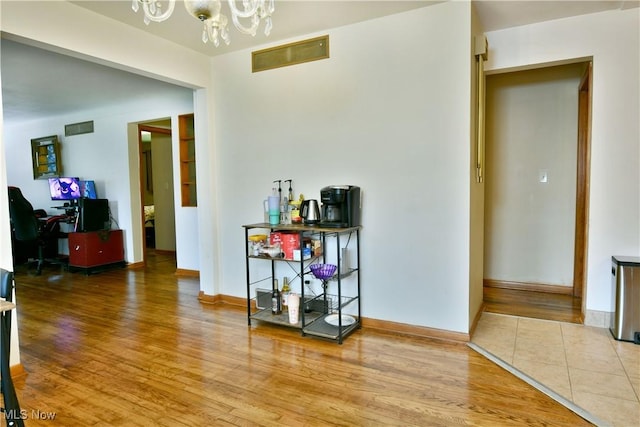 138 Mill Creek Rd, Niles, OH 44446 - dining area with a chandelier, wood finished floors, baseboards, and an office area