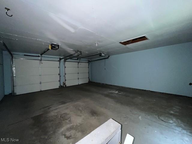 201 Morgan Dr, Painesville, OH 44077 - garage featuring a garage door opener