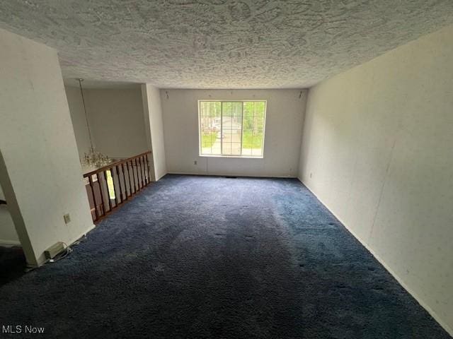 201 Morgan Dr, Painesville, OH 44077 - carpeted spare room featuring a textured ceiling
