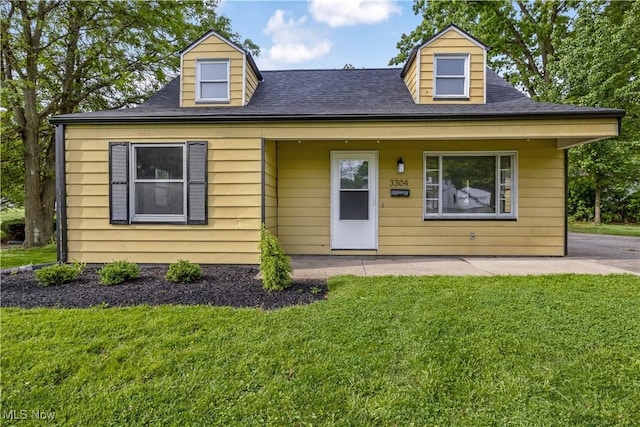 3304 Tangent St, Youngstown, OH 44502 - view of front of house featuring a front lawn, a patio, and a shingled roof