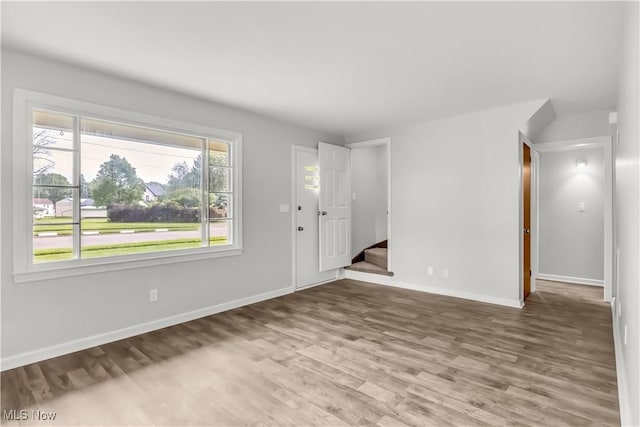 3304 Tangent St, Youngstown, OH 44502 - foyer entrance with wood finished floors, baseboards, and stairs