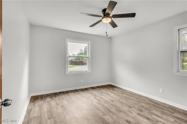 3304 Tangent St, Youngstown, OH 44502 - spare room featuring wood finished floors, a ceiling fan, and baseboards