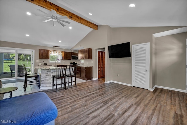 13014 Cherry Ln, Chesterland, OH 44026 - living area with beam ceiling, ceiling fan, wood finished floors, baseboards, and recessed lighting