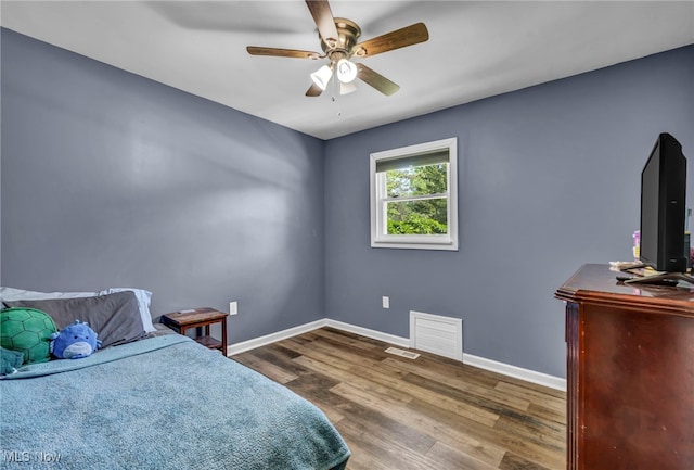 13014 Cherry Ln, Chesterland, OH 44026 - bedroom with wood finished floors, baseboards, and ceiling fan
