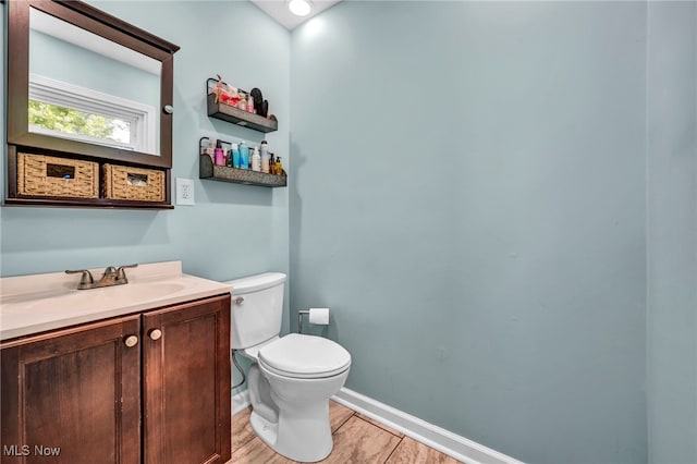 13014 Cherry Ln, Chesterland, OH 44026 - half bathroom with toilet, vanity, and baseboards
