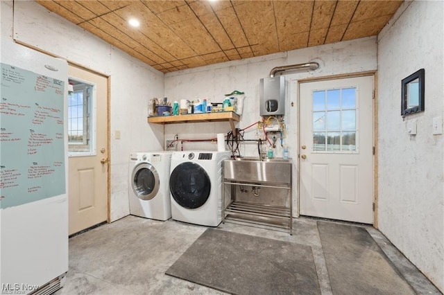 10366 Immel St NE, Canton, OH 44721 - washroom with water heater and washing machine and dryer