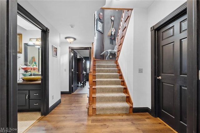 10366 Immel St NE, Canton, OH 44721 - stairs with wood finished floors and baseboards