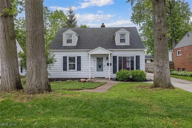 5963 Porter Rd, North Olmsted, OH 44070 - cape cod home with a front lawn, a chimney, and roof with shingles