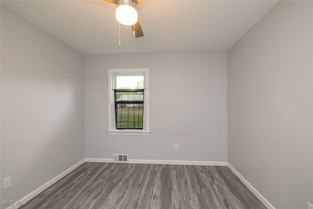 5963 Porter Rd, North Olmsted, OH 44070 - empty room with dark wood-style floors and baseboards