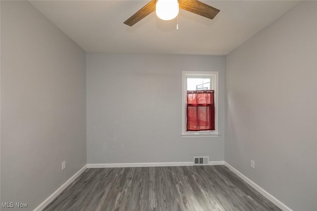 5963 Porter Rd, North Olmsted, OH 44070 - unfurnished room with a ceiling fan, baseboards, and dark wood-style flooring
