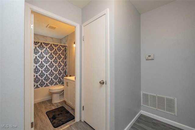 5963 Porter Rd, North Olmsted, OH 44070 - bathroom featuring wood finished floors, vanity, and toilet