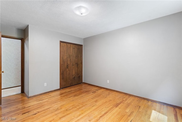 4512 Conestoga Trl, Copley, OH 44321 - unfurnished bedroom with light wood-type flooring, a closet, and baseboards