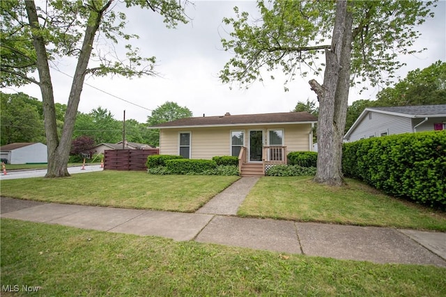 142 Marion Ave, Mogadore, OH 44260 - view of front facade featuring a front yard