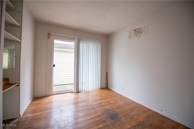 142 Marion Ave, Mogadore, OH 44260 - unfurnished room featuring wood finished floors and baseboards