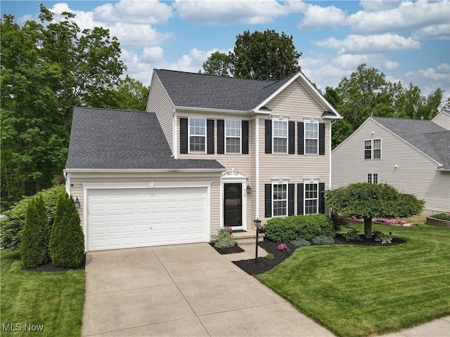 218 Treetop Spur, Copley, OH 44321 - colonial home featuring driveway, a front yard, an attached garage, and a shingled roof