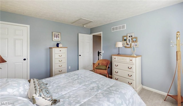 218 Treetop Spur, Copley, OH 44321 - carpeted bedroom with attic access, baseboards, and a textured ceiling