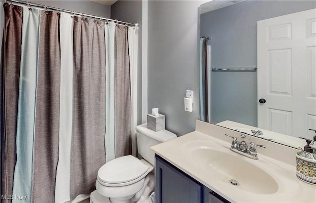 218 Treetop Spur, Copley, OH 44321 - full bathroom featuring toilet, vanity, and a shower with shower curtain