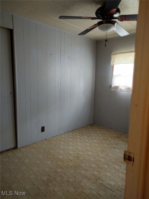 50364 Carroll Rd, East Liverpool, OH 43920 - carpeted empty room with ceiling fan