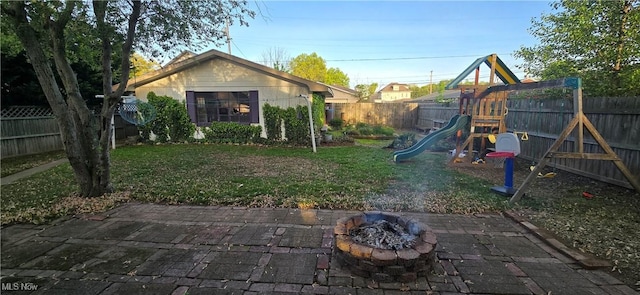4604 7th Ave, Vienna, WV 26105 - view of yard with a playground, a fire pit, and a patio area