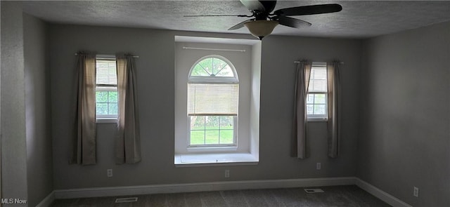 4604 7th Ave, Vienna, WV 26105 - empty room featuring a textured ceiling, baseboards, carpet, and ceiling fan