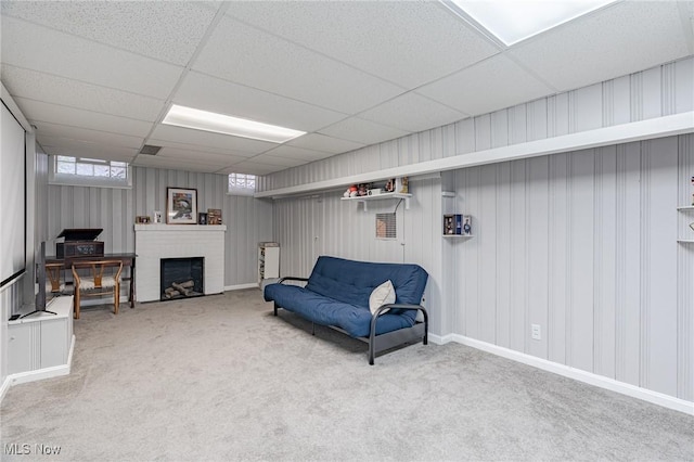 4206 Bushnell Rd, University Heights, OH 44118 - living area featuring a paneled ceiling, carpet floors, and a brick fireplace