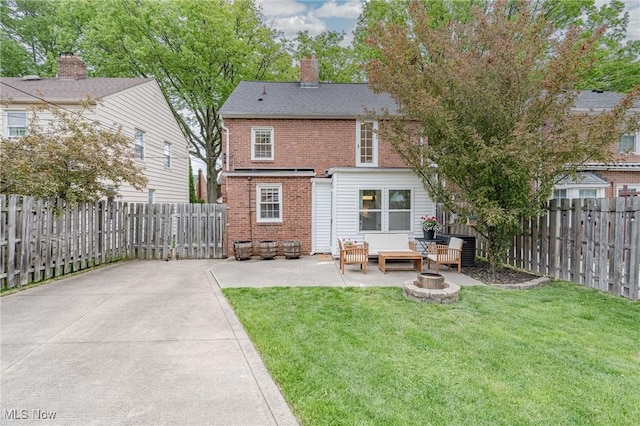 4206 Bushnell Rd, University Heights, OH 44118 - rear view of property with brick siding, a patio area, outdoor lounge area, and a chimney