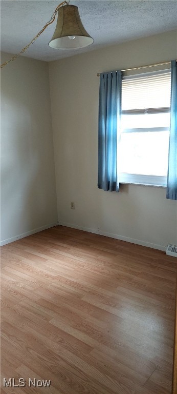 564 Stephens Rd, Akron, OH 44312 - empty room featuring light wood-style flooring and baseboards