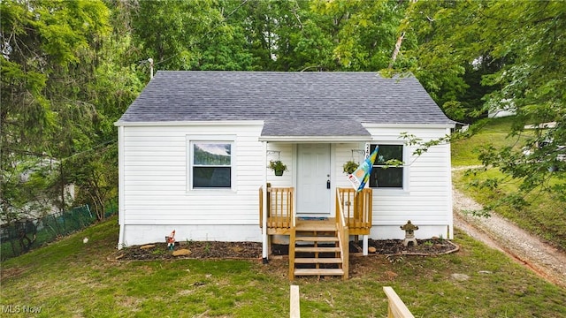2403 45th St, Parkersburg, WV 26104 - bungalow-style house featuring roof with shingles and a front yard