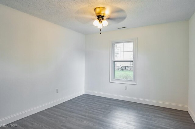 2403 45th St, Parkersburg, WV 26104 - unfurnished room featuring ceiling fan, dark wood-type flooring, a textured ceiling, and baseboards
