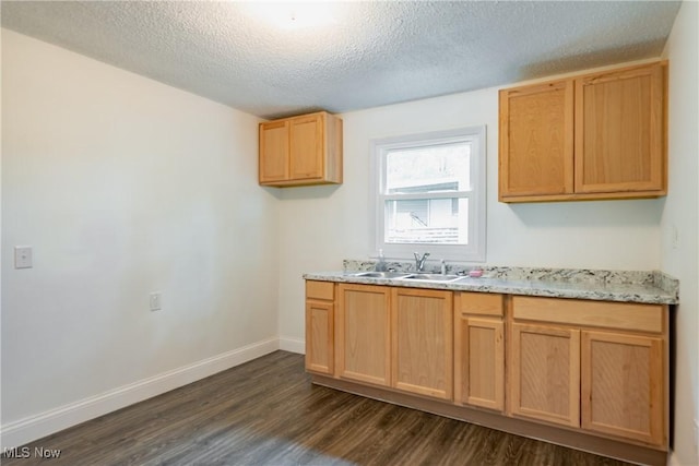 2403 45th St, Parkersburg, WV 26104 - kitchen featuring a sink, dark wood-type flooring, a textured ceiling, baseboards, and light brown cabinets