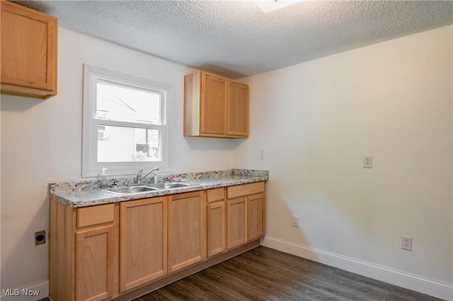 2403 45th St, Parkersburg, WV 26104 - kitchen featuring a sink, dark wood-style flooring, a textured ceiling, baseboards, and light countertops