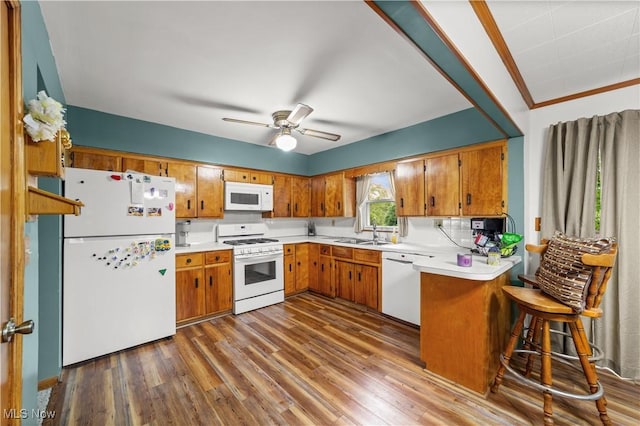 425 Warwick St, Akron, OH 44305 - kitchen featuring white appliances, brown cabinets, a sink, and dark wood finished floors
