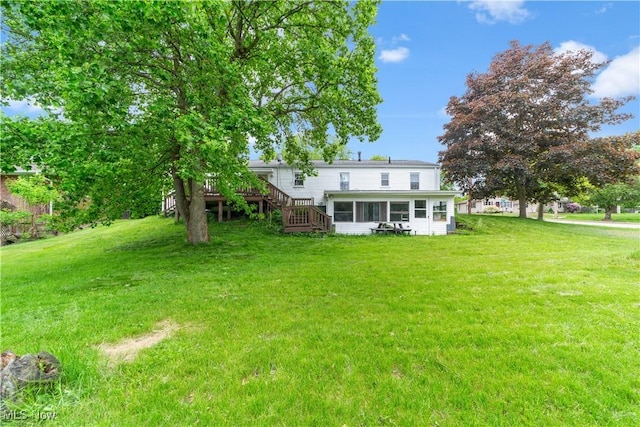 425 Warwick St, Akron, OH 44305 - back of property with a sunroom, stairway, a yard, and a deck