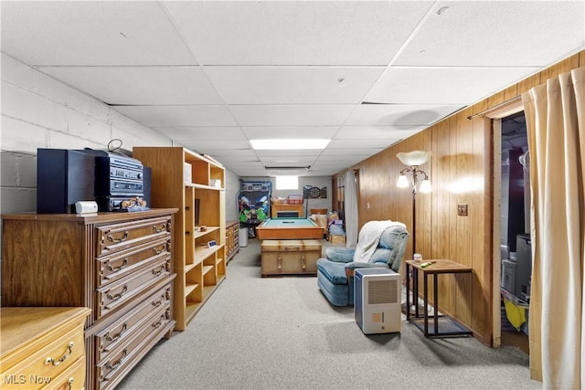 425 Warwick St, Akron, OH 44305 - living area with carpet flooring, a paneled ceiling, and wood walls