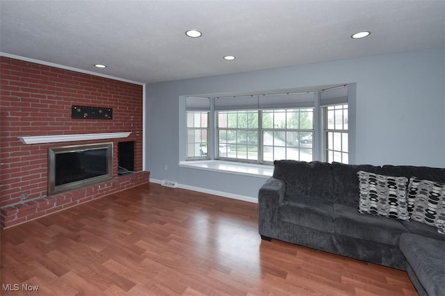 2932 Pease Dr Unit 210, Rocky River, OH 44116 - living room with a brick fireplace, wood finished floors, baseboards, and recessed lighting