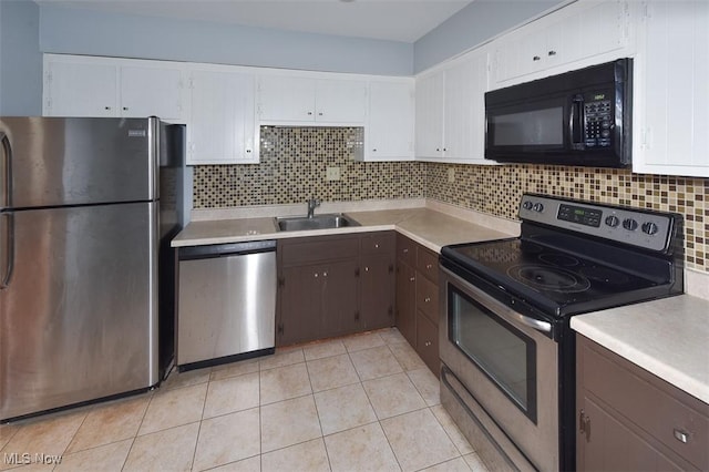 2932 Pease Dr Unit 210, Rocky River, OH 44116 - kitchen featuring appliances with stainless steel finishes, a sink, light countertops, and white cabinetry