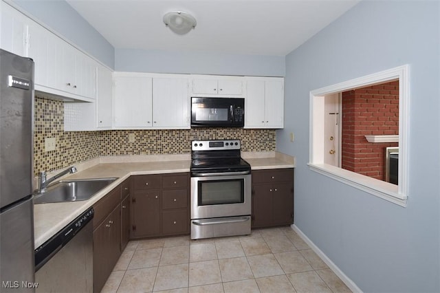 2932 Pease Dr Unit 210, Rocky River, OH 44116 - kitchen featuring stainless steel appliances, a sink, light countertops, backsplash, and white cabinets