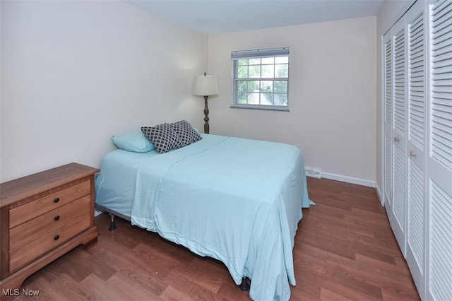 2932 Pease Dr Unit 210, Rocky River, OH 44116 - bedroom featuring wood finished floors, a closet, and baseboards