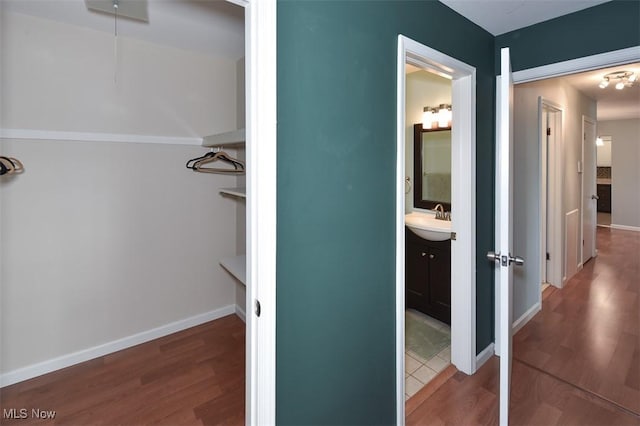 2932 Pease Dr Unit 210, Rocky River, OH 44116 - bathroom with wood finished floors, vanity, and baseboards