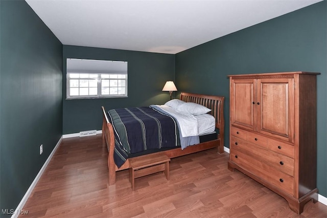 2932 Pease Dr Unit 210, Rocky River, OH 44116 - bedroom featuring baseboards and wood finished floors