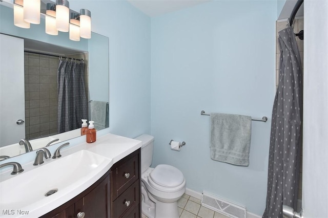 2932 Pease Dr Unit 210, Rocky River, OH 44116 - full bathroom with vanity, toilet, a shower with shower curtain, tile patterned flooring, and baseboards