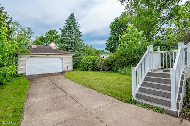 52 20th St SW, Barberton, OH 44203 - view of green lawn with a garage and stairway