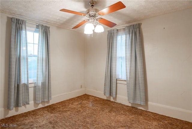 52 20th St SW, Barberton, OH 44203 - carpeted empty room featuring a textured ceiling and ceiling fan