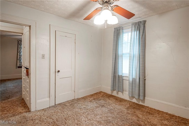 52 20th St SW, Barberton, OH 44203 - spare room with carpet floors, plenty of natural light, a textured ceiling, and a ceiling fan