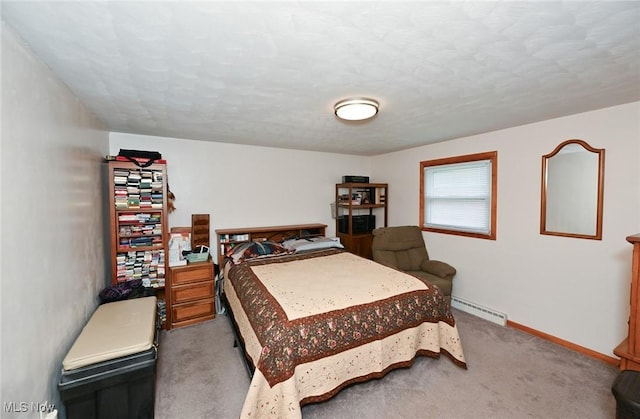 123 Wabash Ave, Orrville, OH 44667 - carpeted bedroom featuring a baseboard heating unit and baseboards