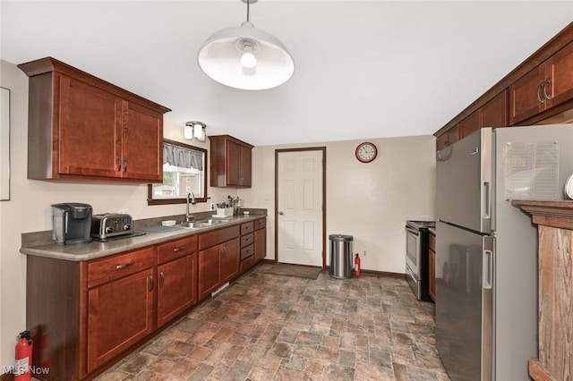123 Wabash Ave, Orrville, OH 44667 - kitchen featuring appliances with stainless steel finishes, a sink, stone finish flooring, and baseboards