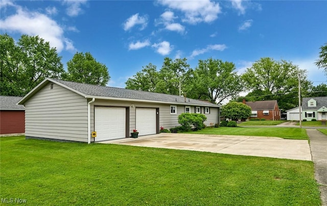 123 Wabash Ave, Orrville, OH 44667 - view of front facade featuring a front lawn, driveway, an attached garage, and a shingled roof