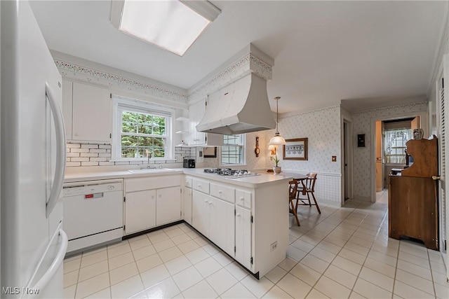 20110 Carolyn Ave, Rocky River, OH 44116 - kitchen featuring white appliances, wallpapered walls, a sink, light countertops, and light tile patterned floors