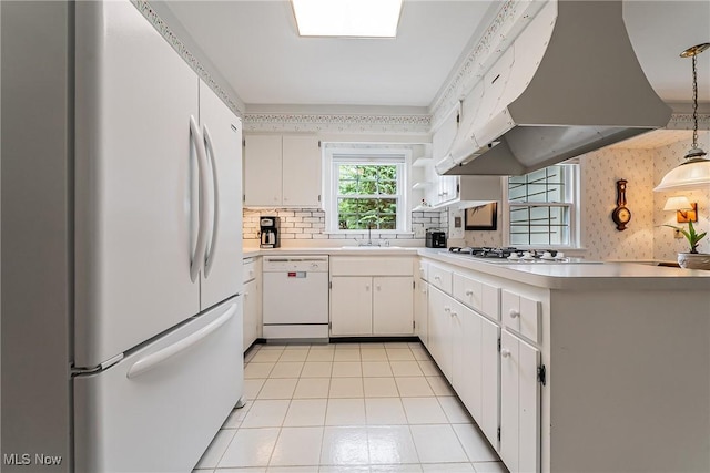 20110 Carolyn Ave, Rocky River, OH 44116 - kitchen with white appliances, exhaust hood, white cabinets, light countertops, and light tile patterned floors