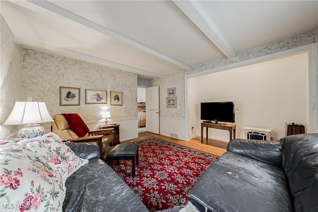20110 Carolyn Ave, Rocky River, OH 44116 - living room with wallpapered walls, beam ceiling, wood finished floors, and a wainscoted wall